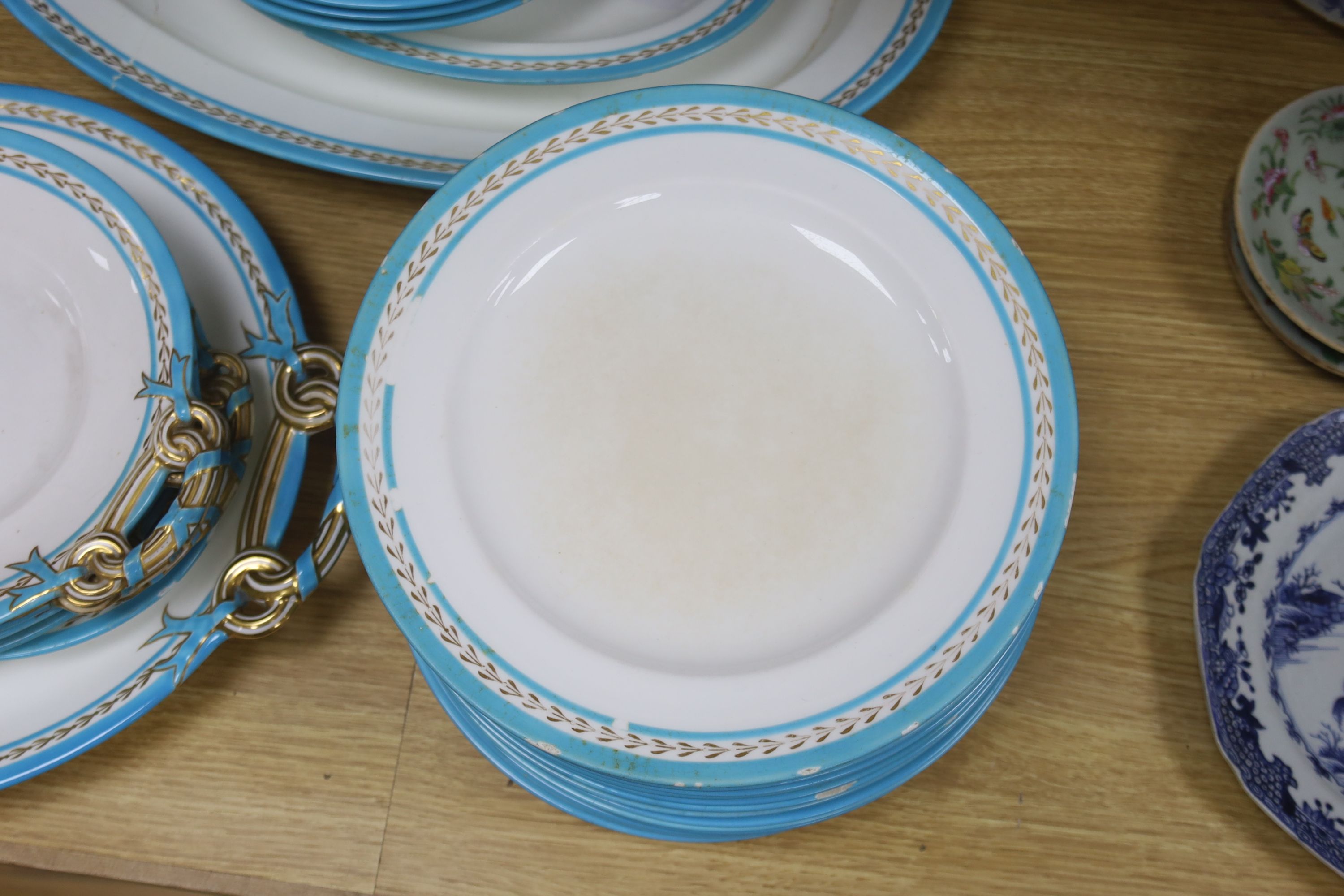 A Victorian Mintons part service with blue and gilt border